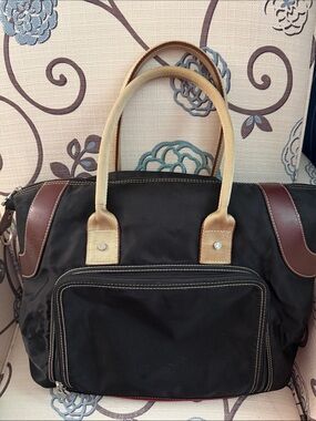 Black Duffel Bag with Tan Handles and Brown Accents